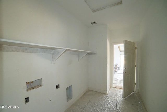 clothes washing area with washer hookup and light tile flooring