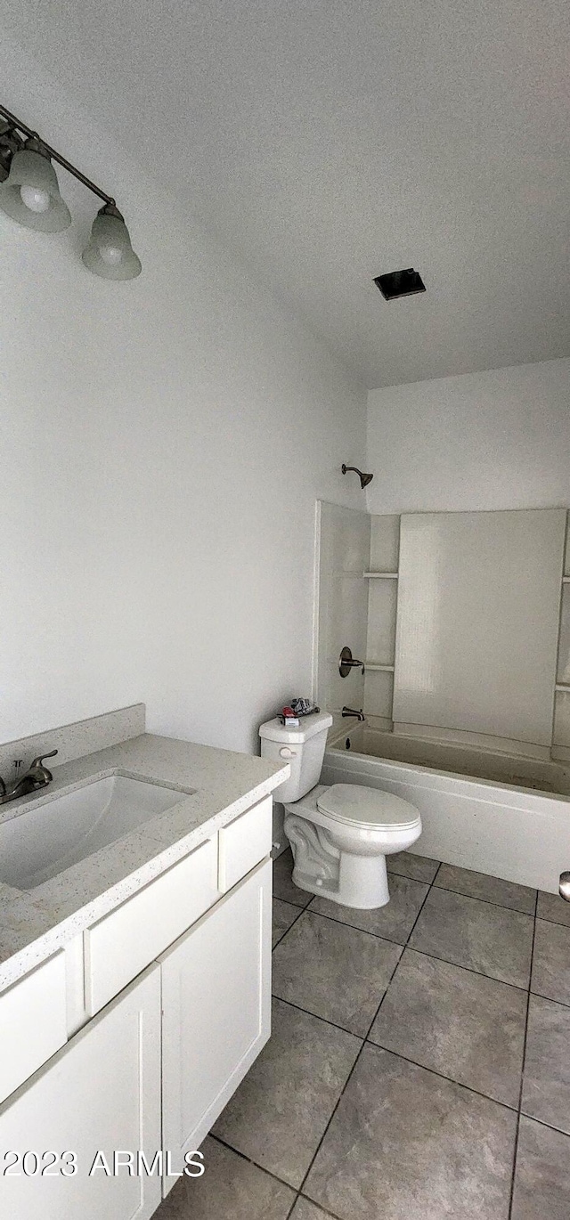 full bathroom featuring vanity, a textured ceiling, tile flooring, toilet, and shower / bath combination