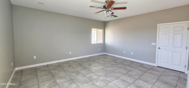 empty room with light tile flooring and ceiling fan