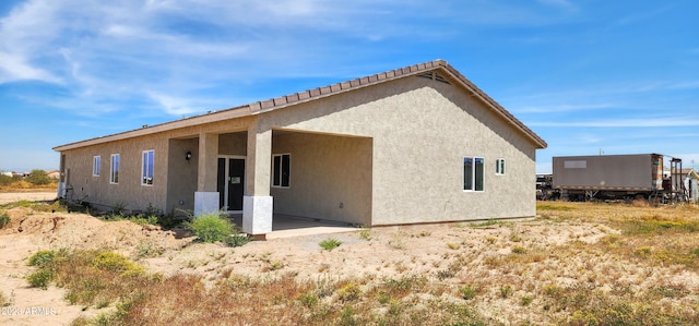 rear view of house with a patio