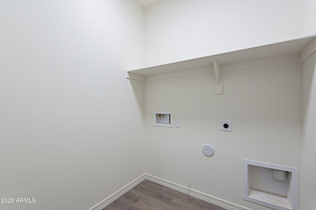 washroom featuring dark wood-style flooring, baseboards, hookup for a gas dryer, washer hookup, and laundry area