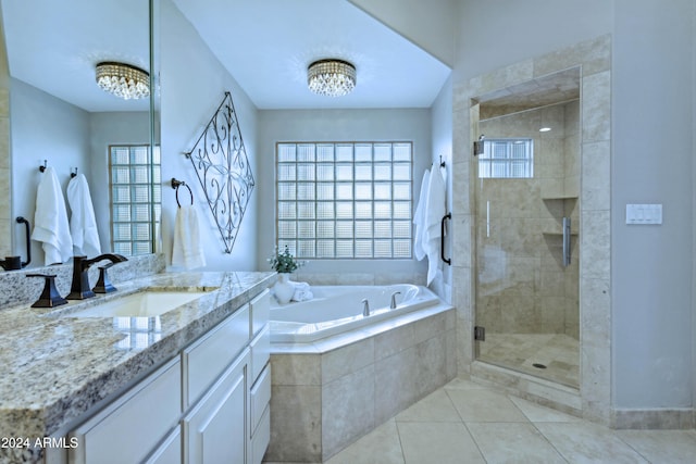 bathroom featuring tile patterned floors, vanity, and independent shower and bath