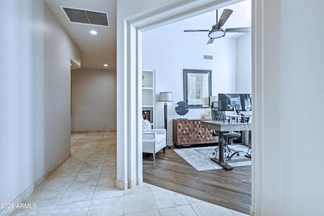 hallway with light hardwood / wood-style flooring