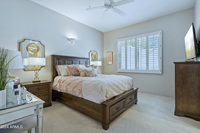 bedroom featuring ceiling fan and light colored carpet