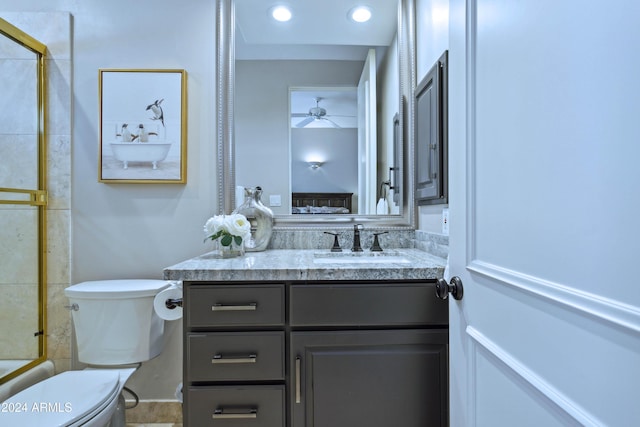 full bathroom with vanity, toilet, and shower / bath combination with glass door