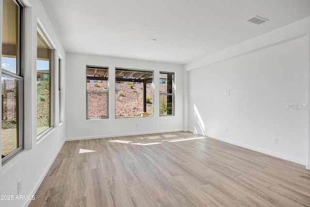 4053 Desert Moon Dr, Wickenburg, AZ 85390 - unfurnished room with light wood finished floors and baseboards