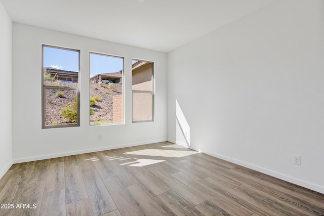 4053 Desert Moon Dr, Wickenburg, AZ 85390 - unfurnished room with healthy amount of natural light and wood finished floors