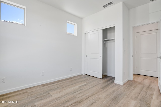 4053 Desert Moon Dr, Wickenburg, AZ 85390 - unfurnished bedroom with light wood-style floors and a closet