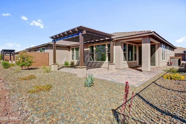 4053 Desert Moon Dr, Wickenburg, AZ 85390 - rear view of house featuring stucco siding, a pergola, a patio area, and a tiled roof