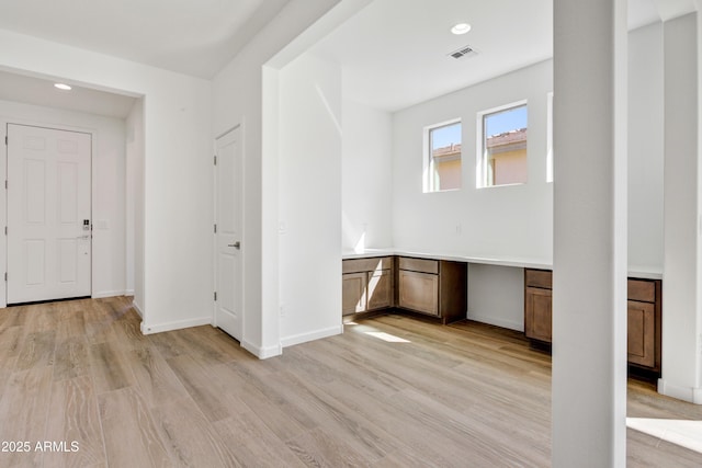 4053 Desert Moon Dr, Wickenburg, AZ 85390 - foyer with light wood finished floors, recessed lighting, and built in desk