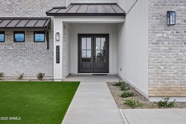 26619 S 169th Pl, Queen Creek, AZ 85142 - doorway to property with a standing seam roof, french doors, metal roof, and brick siding