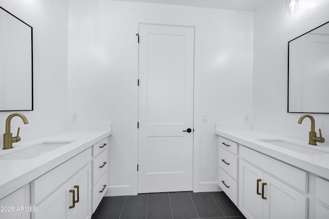 26619 S 169th Pl, Queen Creek, AZ 85142 - bathroom featuring tile patterned floors, baseboards, and two vanities