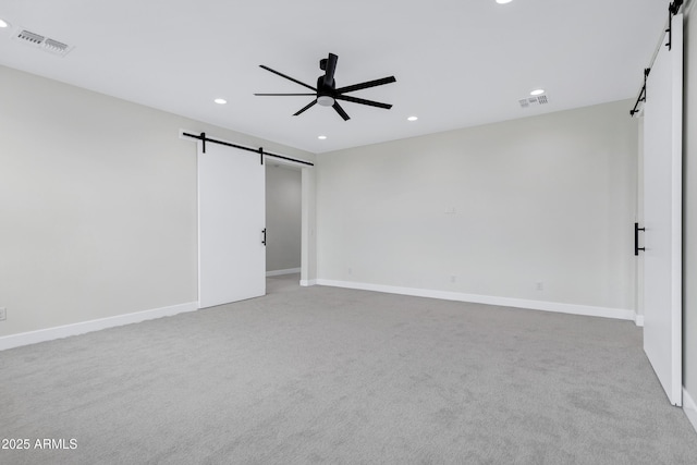 26619 S 169th Pl, Queen Creek, AZ 85142 - unfurnished room featuring a barn door, recessed lighting, ceiling fan, carpet flooring, and baseboards