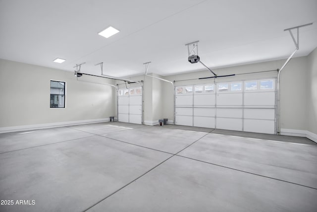 26619 S 169th Pl, Queen Creek, AZ 85142 - garage featuring a garage door opener and baseboards