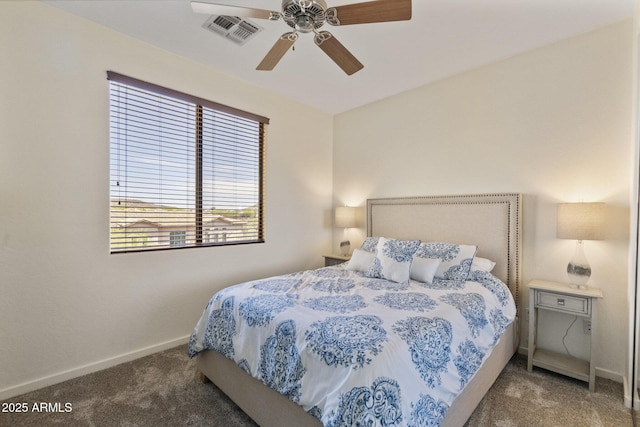 carpeted bedroom with baseboards, a ceiling fan, and visible vents