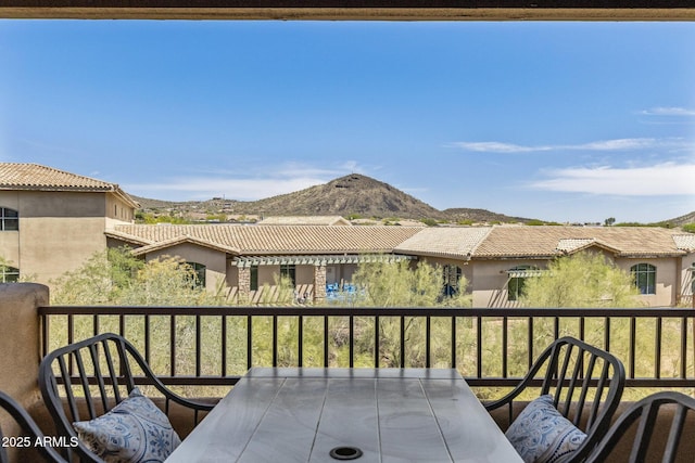 balcony with a residential view and a mountain view