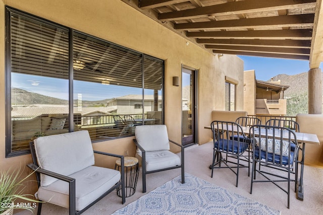 view of patio / terrace featuring a mountain view and a balcony