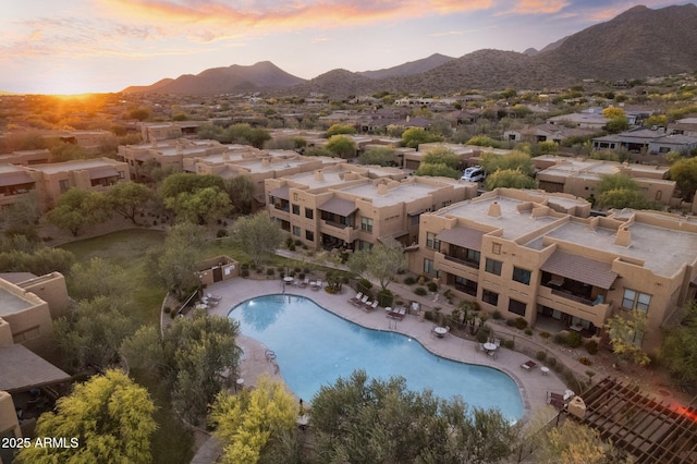 birds eye view of property featuring a mountain view and a residential view