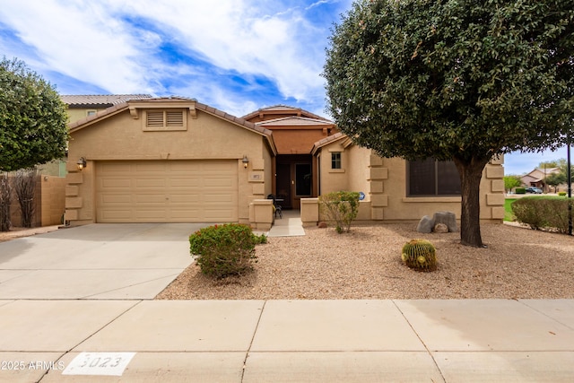 3023 E Silversmith Trl, San Tan Valley, AZ 85143 - view of front of property with stucco siding, driveway, an attached garage, and a tiled roof