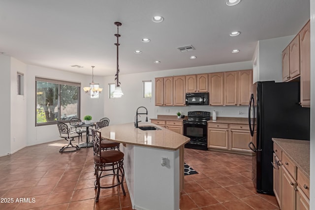 3023 E Silversmith Trl, San Tan Valley, AZ 85143 - kitchen featuring light brown cabinets, visible vents, a sink, black appliances, and a kitchen bar