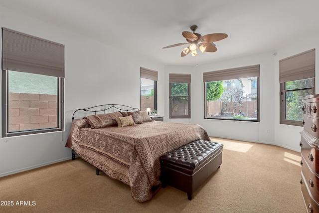 3023 E Silversmith Trl, San Tan Valley, AZ 85143 - carpeted bedroom with multiple windows, a ceiling fan, and baseboards