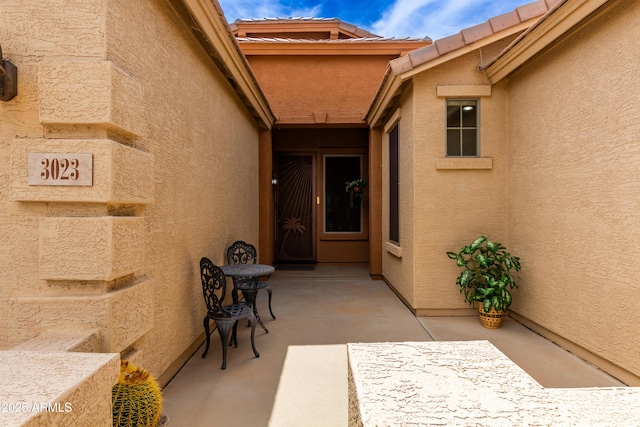 3023 E Silversmith Trl, San Tan Valley, AZ 85143 - property entrance featuring a patio area and stucco siding