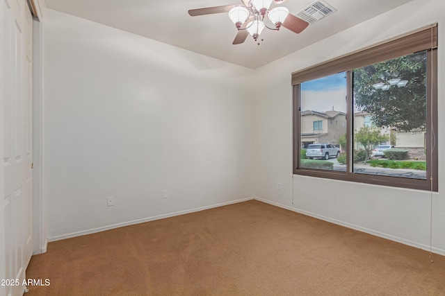 3023 E Silversmith Trl, San Tan Valley, AZ 85143 - unfurnished room featuring baseboards, a ceiling fan, and carpet flooring