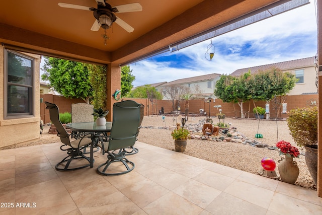 3023 E Silversmith Trl, San Tan Valley, AZ 85143 - view of patio featuring a fenced backyard, outdoor dining space, and a ceiling fan
