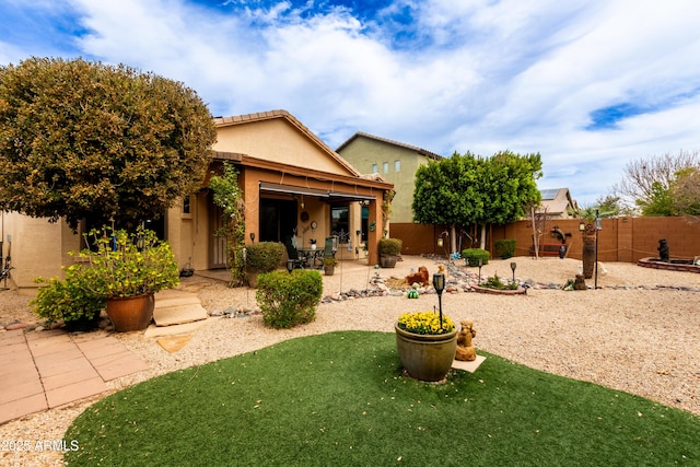 3023 E Silversmith Trl, San Tan Valley, AZ 85143 - back of property with a patio, a fenced backyard, and stucco siding