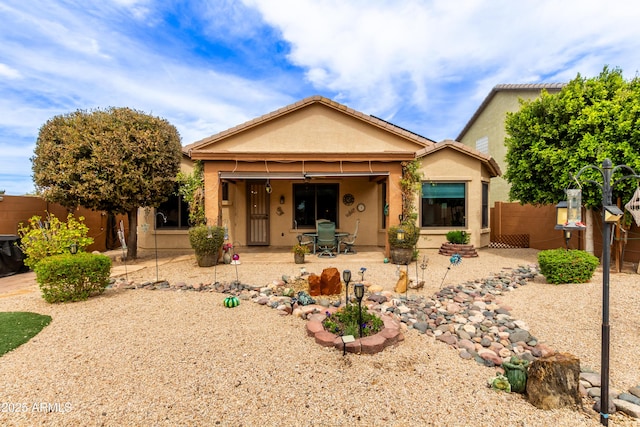 3023 E Silversmith Trl, San Tan Valley, AZ 85143 - view of front of house with a patio area, stucco siding, and fence