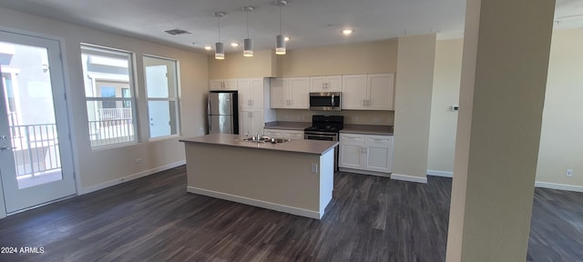 kitchen featuring dark wood finished floors, visible vents, appliances with stainless steel finishes, white cabinets, and a sink