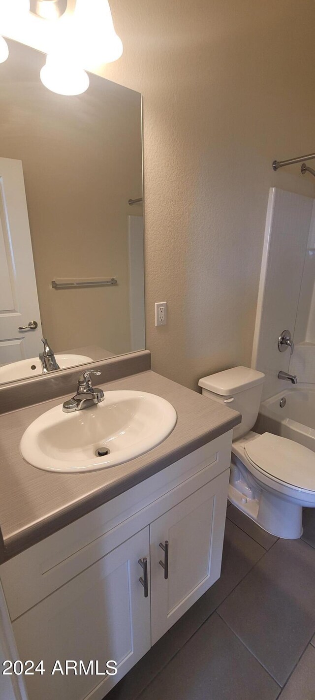 full bathroom featuring toilet, vanity, shower / bathing tub combination, and tile patterned floors