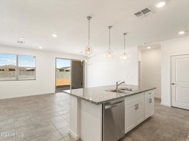 kitchen with sink, white cabinetry, pendant lighting, stainless steel dishwasher, and a center island with sink