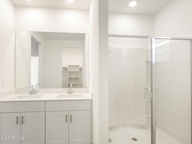 bathroom with vanity and walk in shower