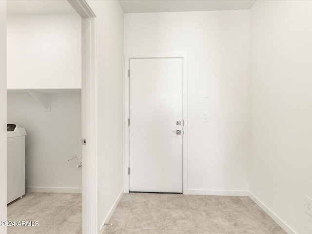 clothes washing area featuring washer / dryer