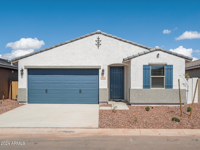 ranch-style house featuring a garage