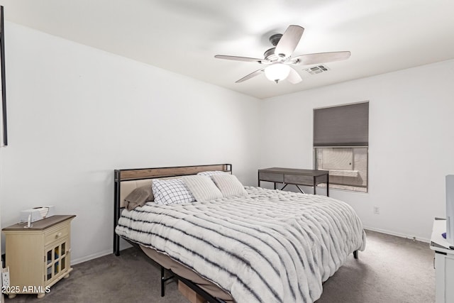 carpeted bedroom with a ceiling fan, baseboards, and visible vents