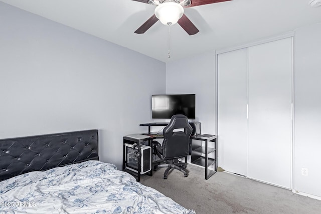 bedroom featuring a closet, ceiling fan, and carpet
