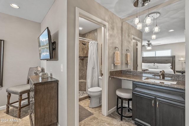 bathroom with tile patterned floors, toilet, walk in shower, vanity, and ceiling fan