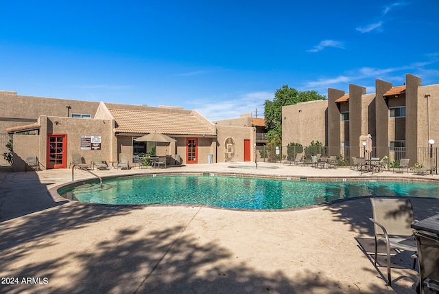 view of swimming pool featuring a patio