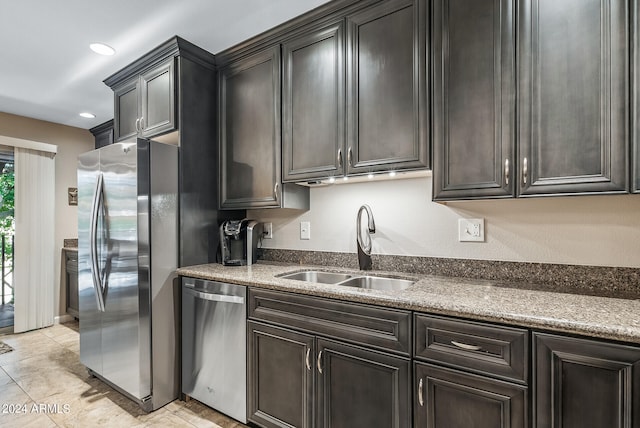 kitchen featuring sink, light tile patterned flooring, and stainless steel appliances