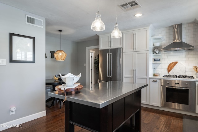 kitchen featuring white cabinets, stainless steel countertops, appliances with stainless steel finishes, wall chimney range hood, and open shelves