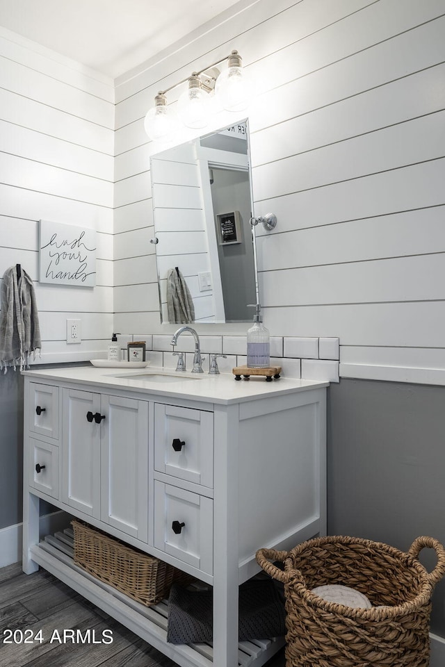 bathroom featuring wood finished floors and vanity