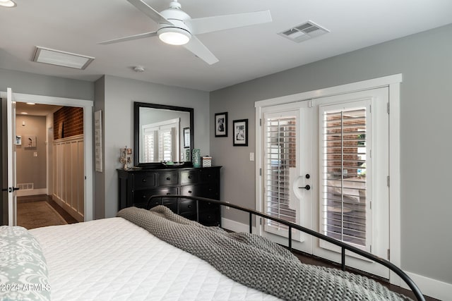 bedroom with access to exterior, visible vents, ceiling fan, and baseboards