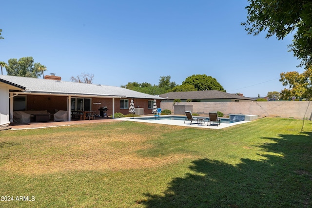 view of yard featuring a patio area, a fenced backyard, and a fenced in pool