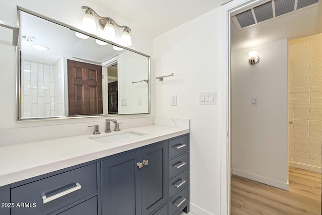 3637 E Monterosa St Unit 8, Phoenix, AZ 85018 - bathroom with wood finished floors and vanity