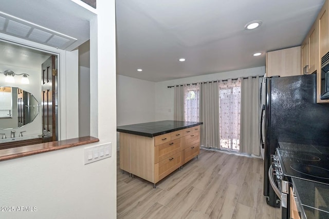 3637 E Monterosa St Unit 8, Phoenix, AZ 85018 - kitchen featuring light brown cabinets, dark countertops, stainless steel electric range oven, light wood finished floors, and recessed lighting