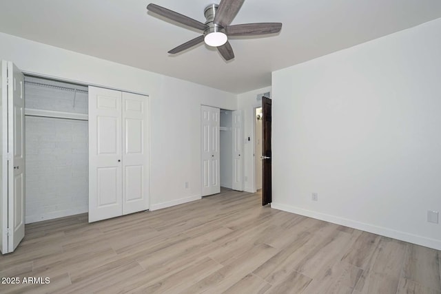 3637 E Monterosa St Unit 8, Phoenix, AZ 85018 - unfurnished bedroom with multiple closets, light wood-type flooring, and ceiling fan