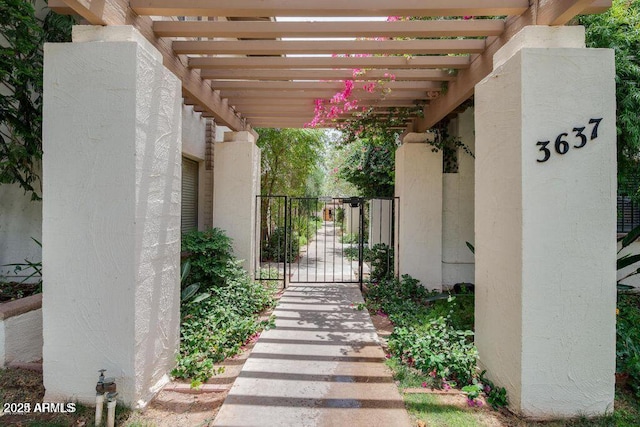3637 E Monterosa St Unit 8, Phoenix, AZ 85018 - view of patio featuring a gate and a pergola