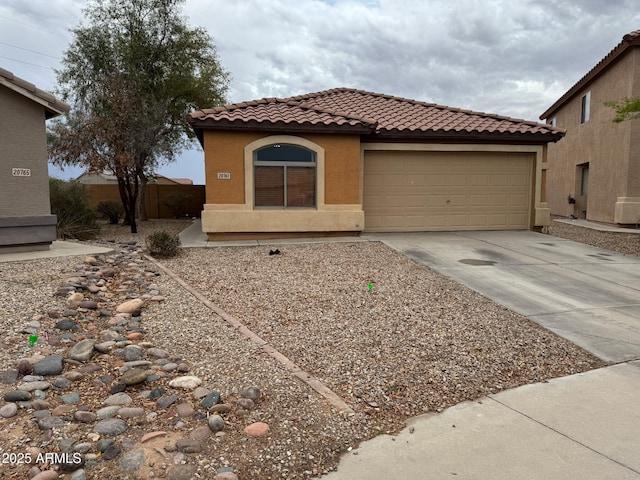 20761 N Herbert Ave, Maricopa, AZ 85138 - mediterranean / spanish home featuring a tiled roof, driveway, a garage, and stucco siding